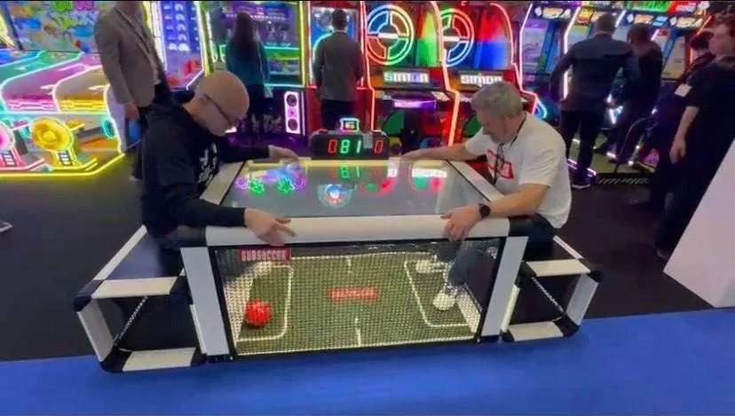 Table Football Arena seated LED football table with two people playing